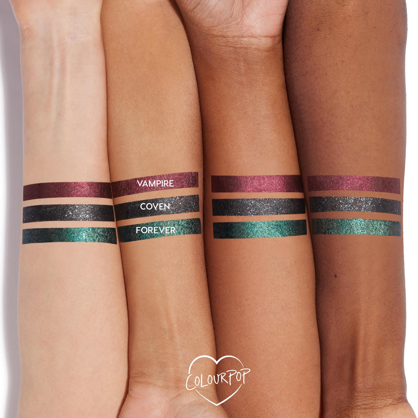ColourPop Graphix Ink Liner in Vampire swatched as a metallic burgundy stripe on three arms in light, medium, and deep tones, shown beside Coven (glittery black) and Forever (teal-green) for shade comparison; long-wearing, high-shine.
